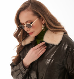 Стильный облегченный пуховик из кожи 